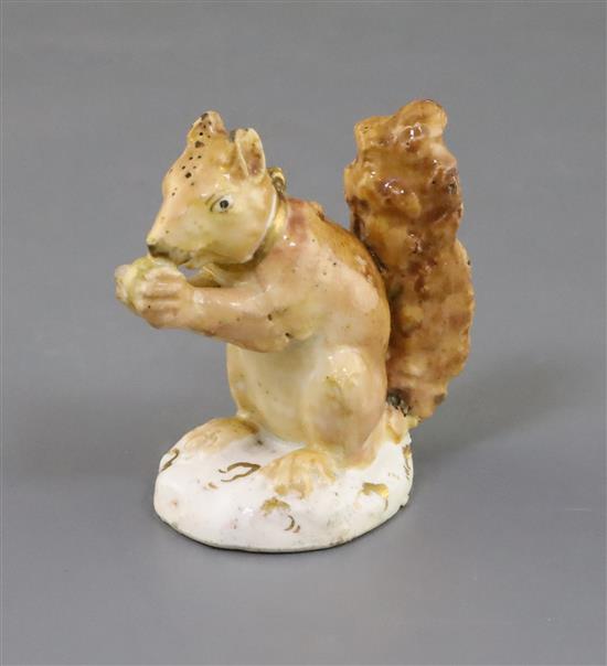 A Rockingham porcelain figure of a red squirrel, c.1830, H. 6cm, chips to ears